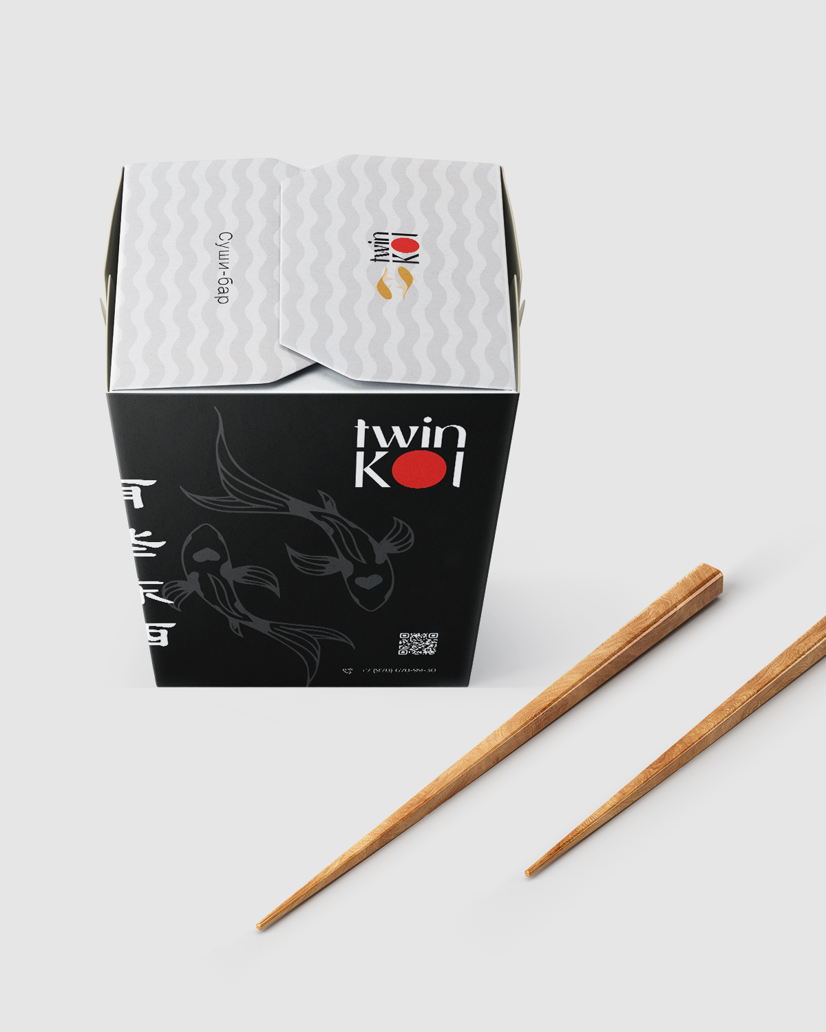 Логотип Twin Koi на коробке для еды
